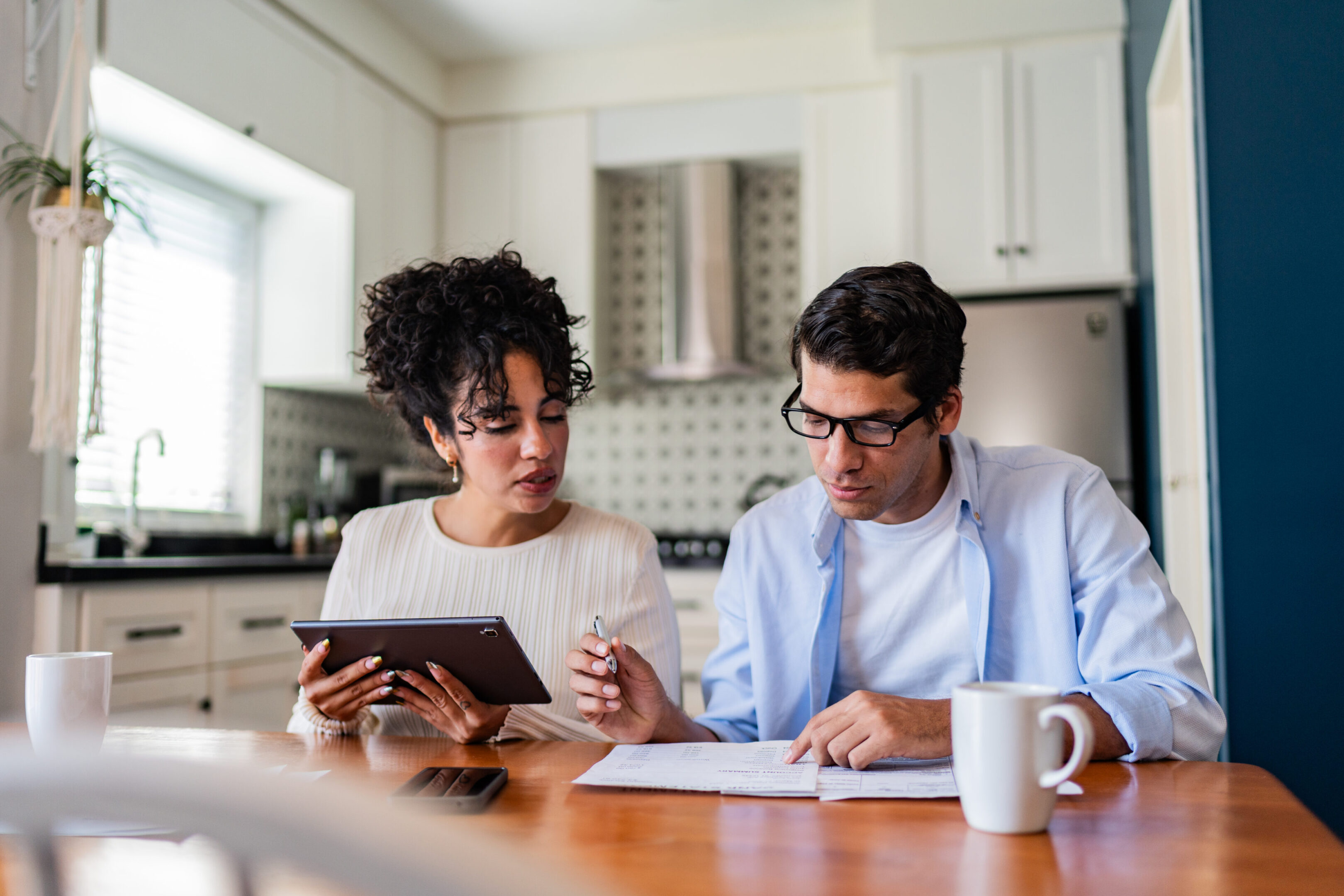 Man and woman discussing paperwork