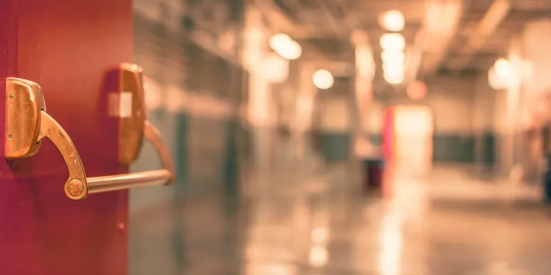 School corridor, focus on door handle