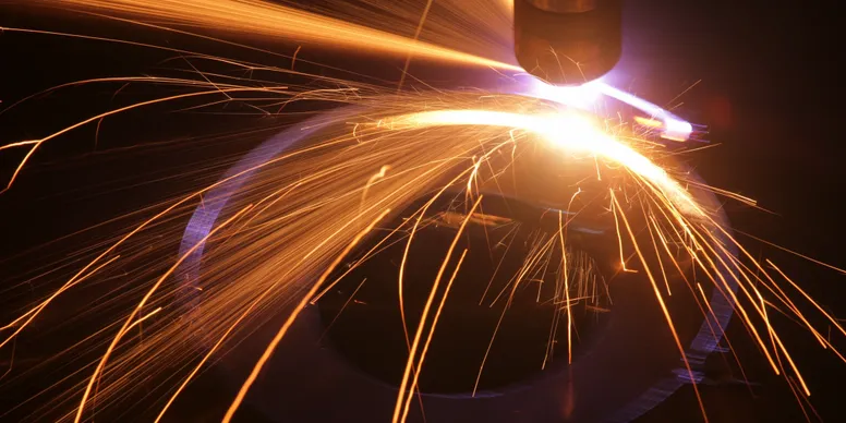 Close-up of industrial metal cutting sparks