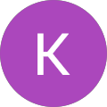 White K on a purple circle