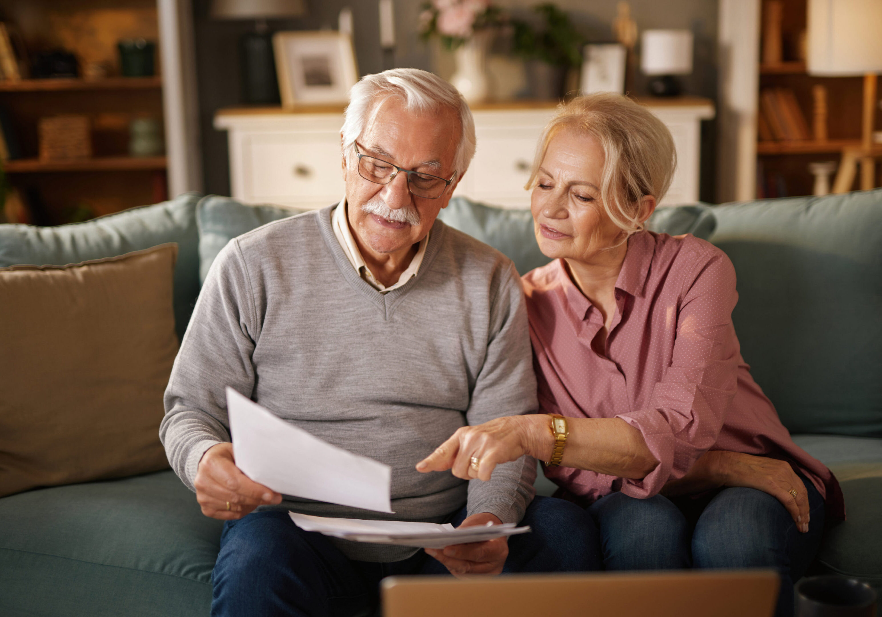 Seniors discussing paperwork at home