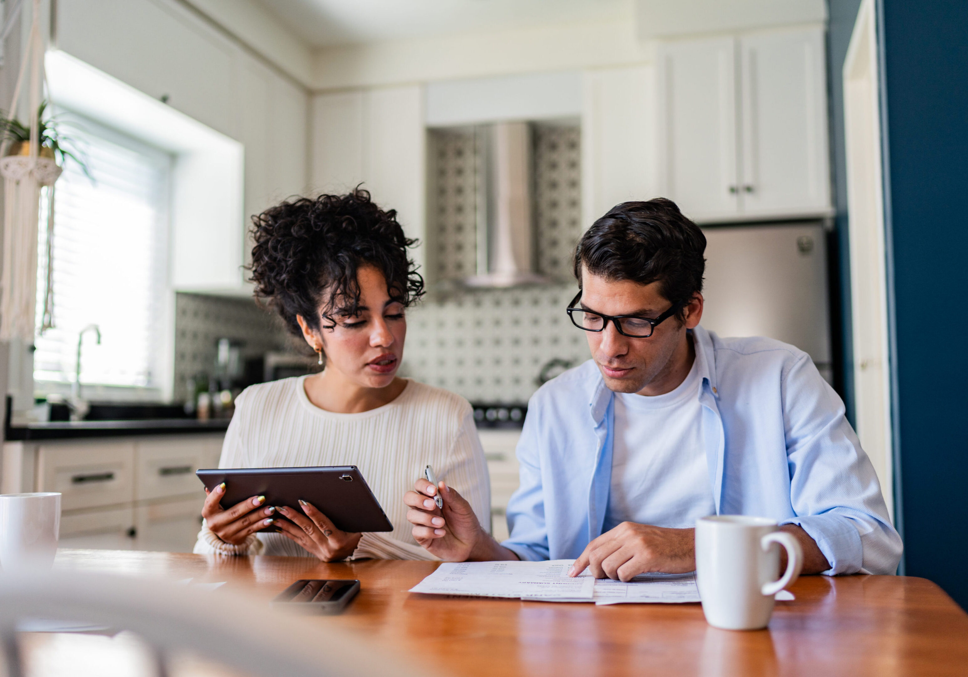 Man and woman discussing paperwork